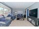Cozy living room with comfortable seating, gray walls, and large windows at 1229 Dallas Dr, Plainfield, IN 46168