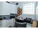 Functional office space with ample storage, a workstation, and a unique window feature at 1229 Dallas Dr, Plainfield, IN 46168