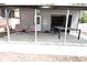 View of the outbuilding showing the seating area, overhead door and lighting at 1229 Dallas Dr, Plainfield, IN 46168
