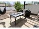Outdoor dining patio includes table, outdoor kitchen, and backyard views in a shaded, private space at 1229 Dallas Dr, Plainfield, IN 46168
