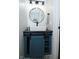 Powder room boasts a modern vessel sink, stylish fixtures, and rustic storage beneath at 1229 Dallas Dr, Plainfield, IN 46168