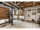 Unfinished basement featuring tile floor, water heater, and shelving unit; ideal for storage and customization at 12613 Carrington Pl, Carmel, IN 46033