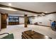 Spacious basement with neutral carpet, wood accents, a bar and entertainment area, and recessed lighting at 12613 Carrington Pl, Carmel, IN 46033