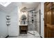 Nicely appointed bathroom featuring a walk-in shower, a vanity with drawers, and nice tiling at 12613 Carrington Pl, Carmel, IN 46033