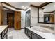 Bathroom boasting a soaking tub with tile surround, vanity and a glass-enclosed shower at 12613 Carrington Pl, Carmel, IN 46033