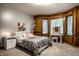 Inviting bedroom with plenty of natural light, a vanity table, and hardwood trim at 12613 Carrington Pl, Carmel, IN 46033