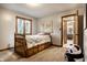 Charming bedroom with a built-in bed frame including drawers for storage and view of the bathroom at 12613 Carrington Pl, Carmel, IN 46033