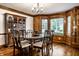 Dining room with hardwood floors, a large table, and wood accents, creating an elegant space for dining at 12613 Carrington Pl, Carmel, IN 46033