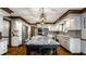 Bright kitchen with stainless steel appliances, white cabinets, granite counters, and a large island with seating at 12613 Carrington Pl, Carmel, IN 46033