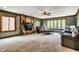 Relaxing living room with a brick fireplace, large windows, and comfortable seating for entertaining guests at 12613 Carrington Pl, Carmel, IN 46033