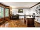 Elegant office features wood-paneled walls, a grand piano, and a large desk with an oversized clock at 12613 Carrington Pl, Carmel, IN 46033