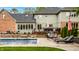 A backyard pool and patio with outdoor seating, including a grill, for entertaining and relaxation at 12613 Carrington Pl, Carmel, IN 46033