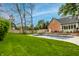 A backyard swimming pool surrounded by a lush lawn and landscaping, offering a relaxing outdoor space at 12613 Carrington Pl, Carmel, IN 46033