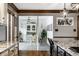 Bright sunroom with tiled floors, ceiling fan, vintage furniture, and view to backyard and pool at 12613 Carrington Pl, Carmel, IN 46033