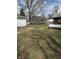 View of a spacious backyard with lush green grass and mature trees on a sunny day at 130 Hiawatha Dr, Noblesville, IN 46062