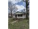 Cozy single-story home with a covered front porch and mature trees in the yard at 130 Hiawatha Dr, Noblesville, IN 46062