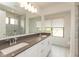 Beautiful bathroom with double vanity, large mirror, and a glass enclosed shower at 13349 Minden Dr, Fishers, IN 46037