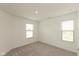Bright bedroom with neutral carpeting, and two large windows providing lots of natural light at 13349 Minden Dr, Fishers, IN 46037