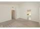 Spacious bedroom with neutral carpeting and view to the ensuite bathroom and walk-in closet at 13349 Minden Dr, Fishers, IN 46037