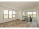 Bright bonus room with windows, vinyl floors, recessed lighting, and open staircase with metal railings at 13349 Minden Dr, Fishers, IN 46037