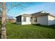 The backyard features a lush lawn and a sunroom, perfect for outdoor relaxation and enjoyment at 1366 Swan Dr, Franklin, IN 46131