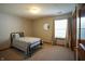 This cozy bedroom features neutral walls, carpet, and a comfortable bed for a peaceful retreat at 1366 Swan Dr, Franklin, IN 46131