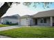 Inviting single-story home featuring a brick facade, well-maintained lawn, and an attached garage at 1366 Swan Dr, Franklin, IN 46131