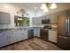 Well-equipped kitchen with modern stainless steel appliances, stylish countertops, and wood flooring at 1366 Swan Dr, Franklin, IN 46131