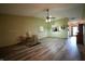 Open-concept living room with hardwood floors, neutral walls, and an open view to the kitchen at 1366 Swan Dr, Franklin, IN 46131