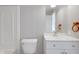 Bright bathroom with toilet, single vanity, and tub with shower at 1528 E 300 N, Lebanon, IN 46052