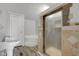 Bathroom with a pedestal sink, corner tub, and shower stall at 1528 E 300 N, Lebanon, IN 46052