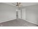 Neutral bedroom with carpet, ceiling fan, and two closets at 1528 E 300 N, Lebanon, IN 46052