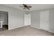 Bedroom featuring a ceiling fan, carpet, and two closets at 1528 E 300 N, Lebanon, IN 46052