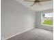 Bright bedroom with carpet, light-colored walls, and large window at 1528 E 300 N, Lebanon, IN 46052