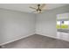 Cozy carpeted bedroom with a ceiling fan and natural light at 1528 E 300 N, Lebanon, IN 46052