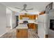 The kitchen features wood cabinets, stainless appliances, and an island with stylish flooring at 1528 E 300 N, Lebanon, IN 46052