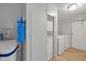 View of the laundry room featuring a water softener and modern washer and dryer at 1528 E 300 N, Lebanon, IN 46052