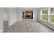 Open floorplan of the living room and kitchen in this home with stylish floors at 1528 E 300 N, Lebanon, IN 46052
