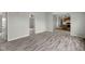 The living room features an open concept design with stylish flooring and neutral walls at 1528 E 300 N, Lebanon, IN 46052