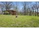 Spacious backyard featuring mature trees and a volleyball net, perfect for outdoor recreation and enjoying the natural surroundings at 00 Oak Rd, Westfield, IN 46074