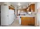 Traditional kitchen with wood cabinets, white appliances, and a view into the next room at 00 Oak Rd, Westfield, IN 46074
