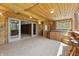Inviting sunroom with wood paneled ceiling, bar seating, and relaxing hot tub at 00 Oak Rd, Westfield, IN 46074