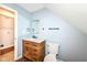 Bathroom with wood vanity and mirror at 1814 New St, Indianapolis, IN 46203