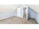 Bedroom featuring light blue walls, carpet, and attic ceiling at 1814 New St, Indianapolis, IN 46203