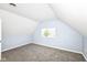 Bedroom featuring light blue walls, carpet, and a window at 1814 New St, Indianapolis, IN 46203