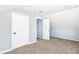 Bedroom featuring light blue walls, carpet, and a closet at 1814 New St, Indianapolis, IN 46203