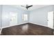This comfortable living room has wood floors, fresh paint, modern lighting, and plenty of natural light at 1814 New St, Indianapolis, IN 46203