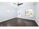 Bright living room has wood floors, updated paint, modern lighting, and a door to the exterior at 1814 New St, Indianapolis, IN 46203