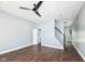Open living room offers wood floors, fresh paint, updated lighting, and convenient access to the stairs at 1814 New St, Indianapolis, IN 46203