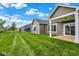 Manicured lawn and beautiful exteriors of homes showcase backyard outdoor living at 19123 River Jordan Pass, Westfield, IN 46074